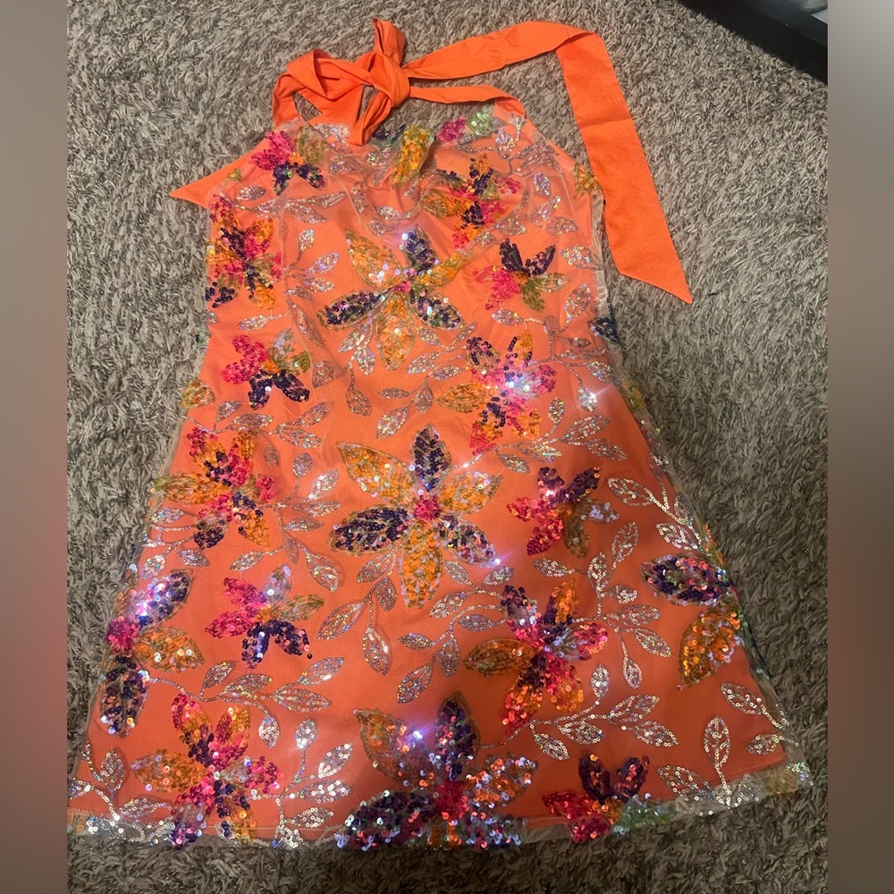 A show stopper! Beautiful orange with a stunning overlay of floral sequins.